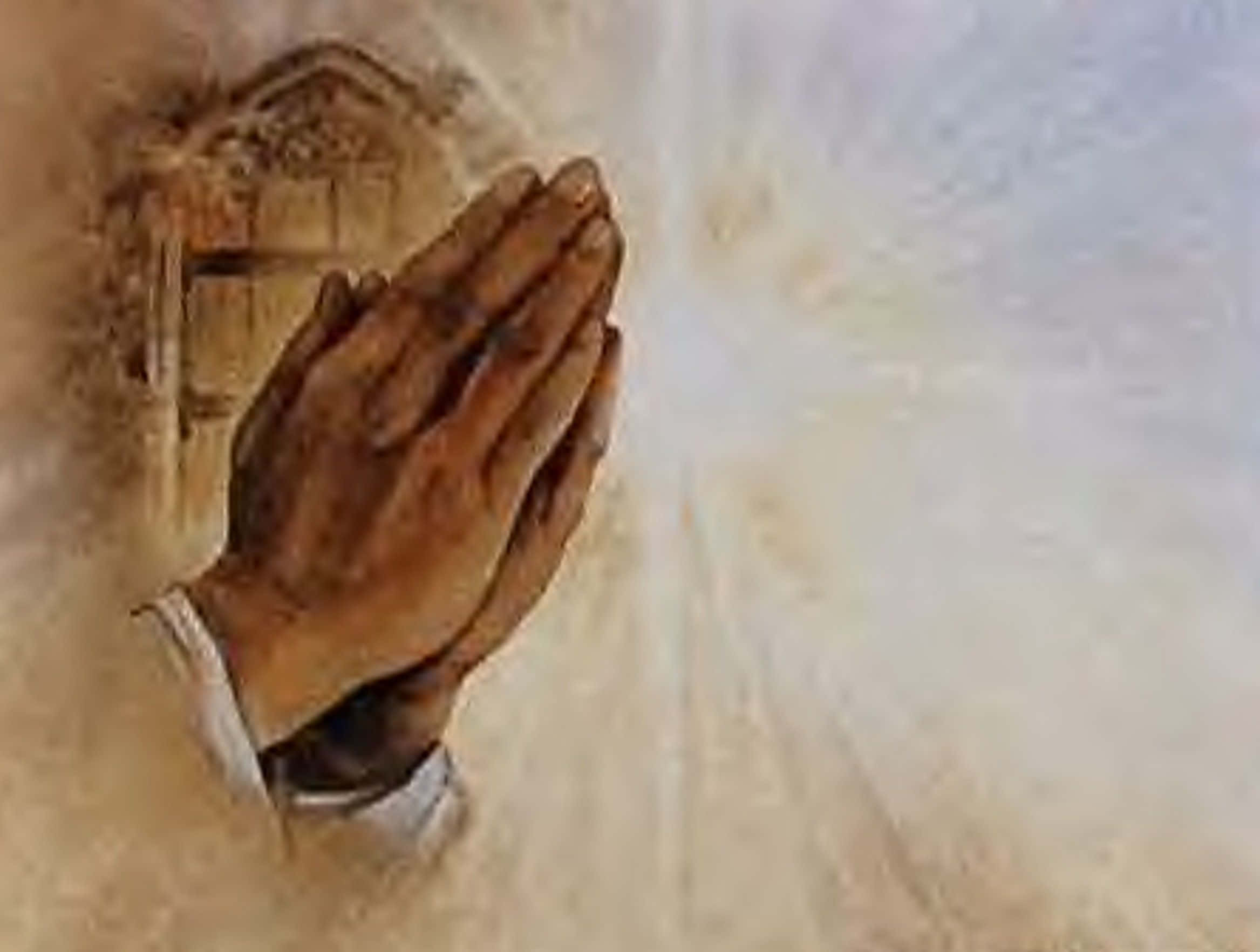 Praying 桌布 壁紙 — 雙手合十祈禱，之間散發出柔和的光芒，背景為柔軟的紋理。
