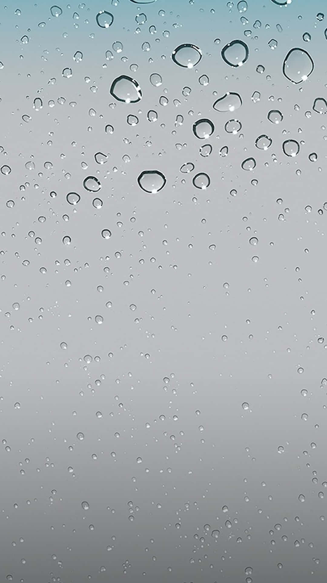 iOS 4 桌布 壁紙 — 雨滴依附在玻璃表面，背景是從冷藍色過渡到柔和灰色的漸變天空。