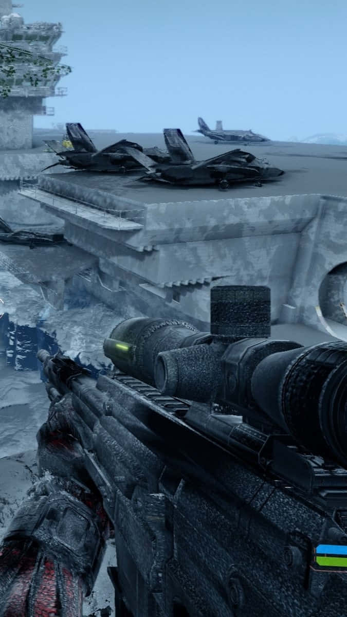 Android Crysis Warhead 桌布 壁紙 — 雪地航空母艦上戰鬥機與步槍瞄準鏡的第一人稱視角，處於寒冷戰區。
