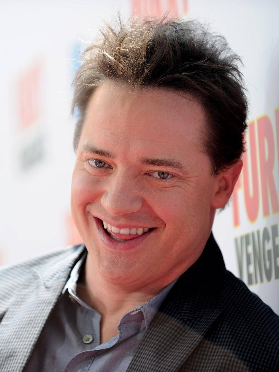 Celebrity 桌布 壁紙 — 電影首映活動中，一個微笑的男士的近照，頭髮凌亂。