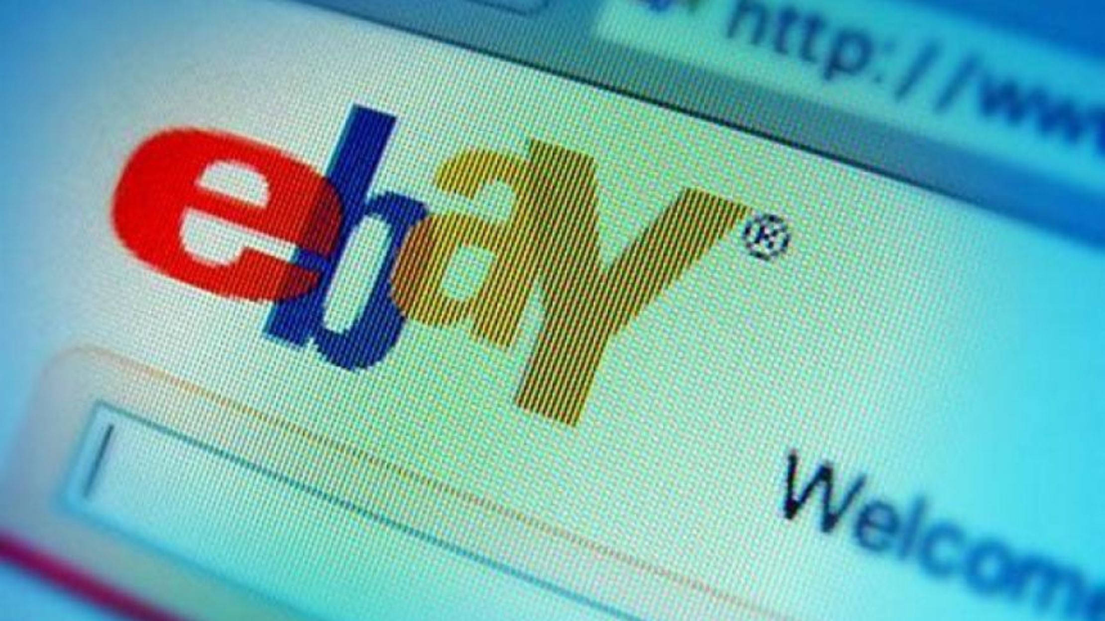 eBay 桌布 壁紙 — 電腦螢幕上顯示的eBay標誌特寫，帶有歡迎訊息和可見的網址列。