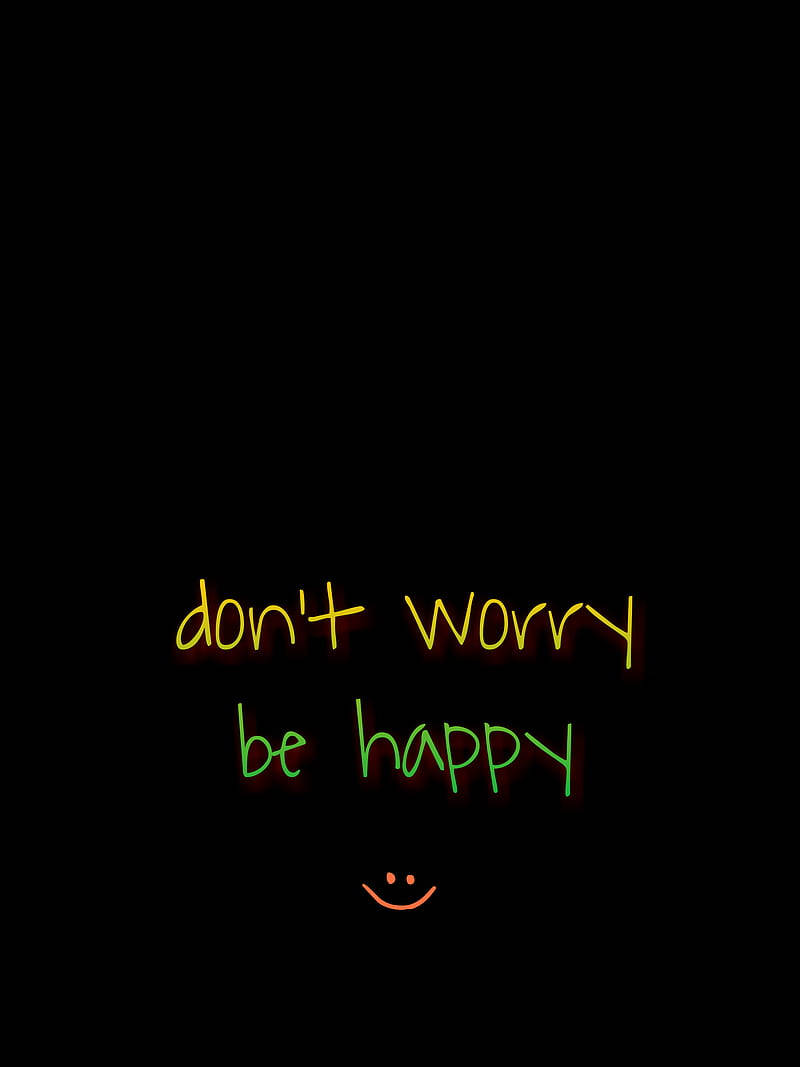 霓虹發光文字寫著 don't worry be happy，並帶有笑臉。