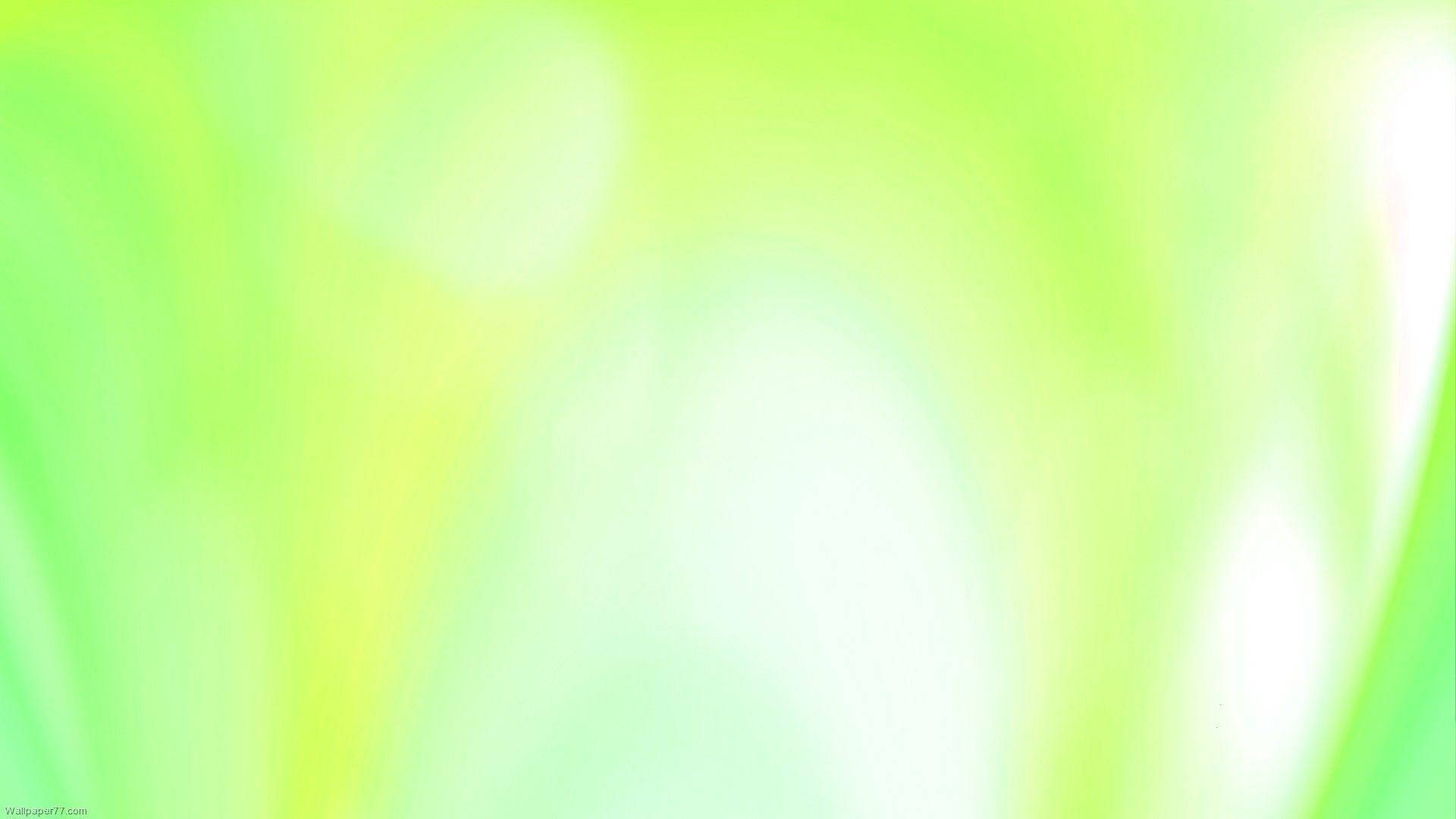 抽象 桌布 壁紙 — 青檸綠和淡黃色的柔和漸變，帶有模糊的光線條紋，營造出夢幻般的抽象光芒。