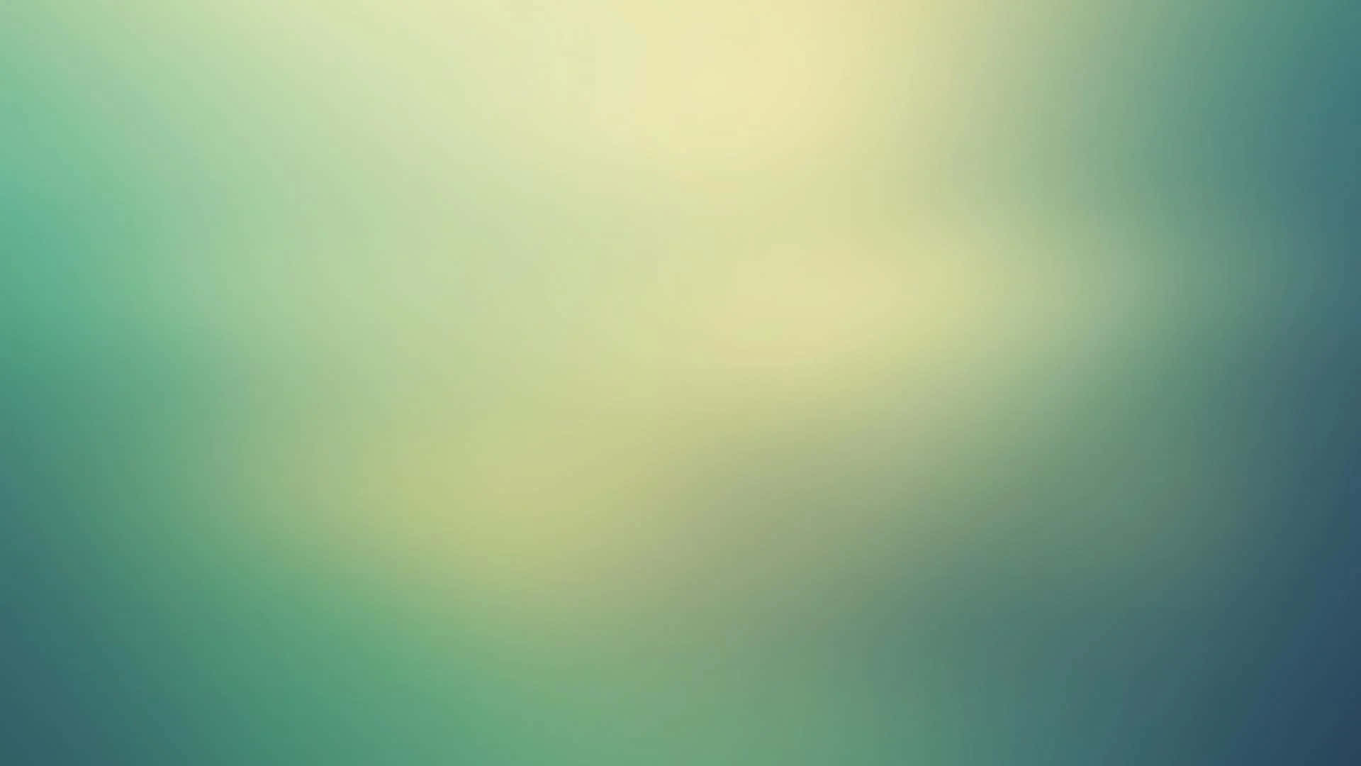 Faded 桌布 壁紙 — 青綠色與淡黃色的柔和漸變，融合成夢幻般的抽象背景。