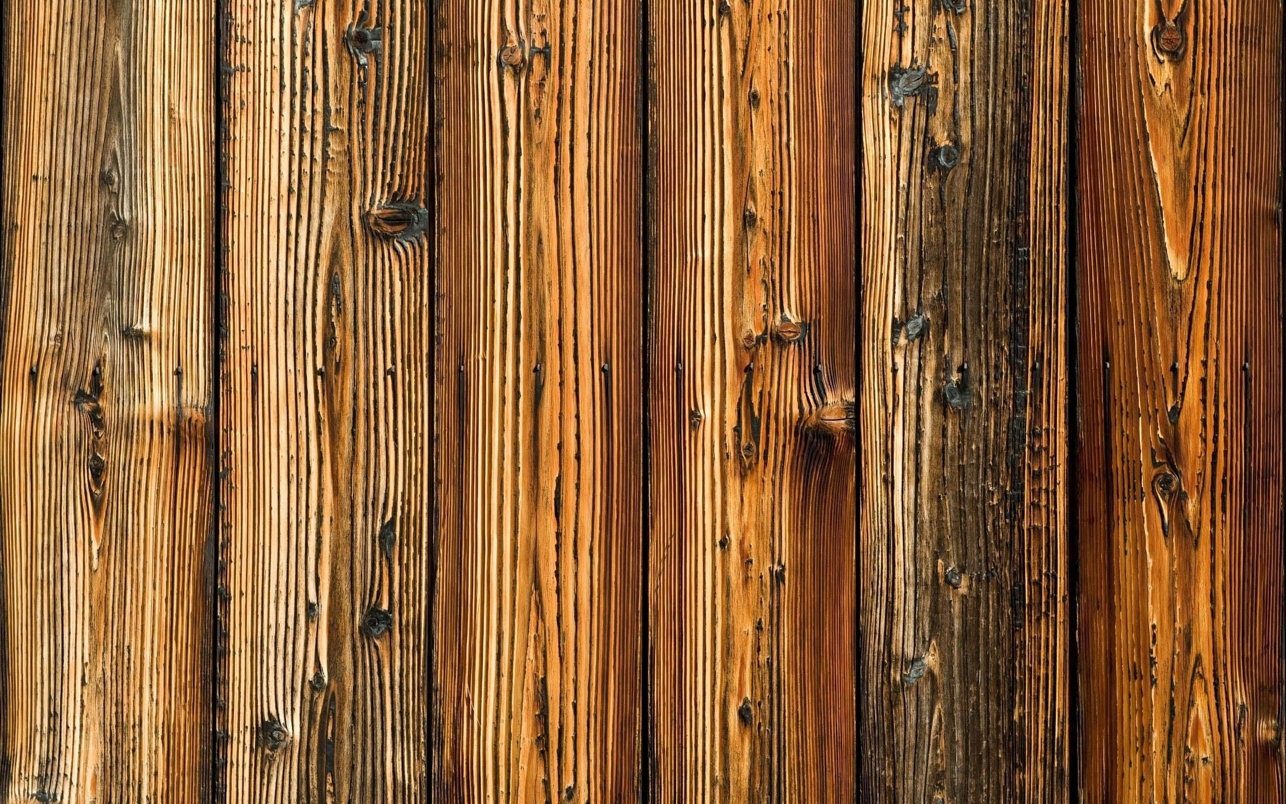 Wooden 桌布 壁紙 — 風化垂直木板的特寫，帶有豐富的琥珀色調和天然木紋圖案。