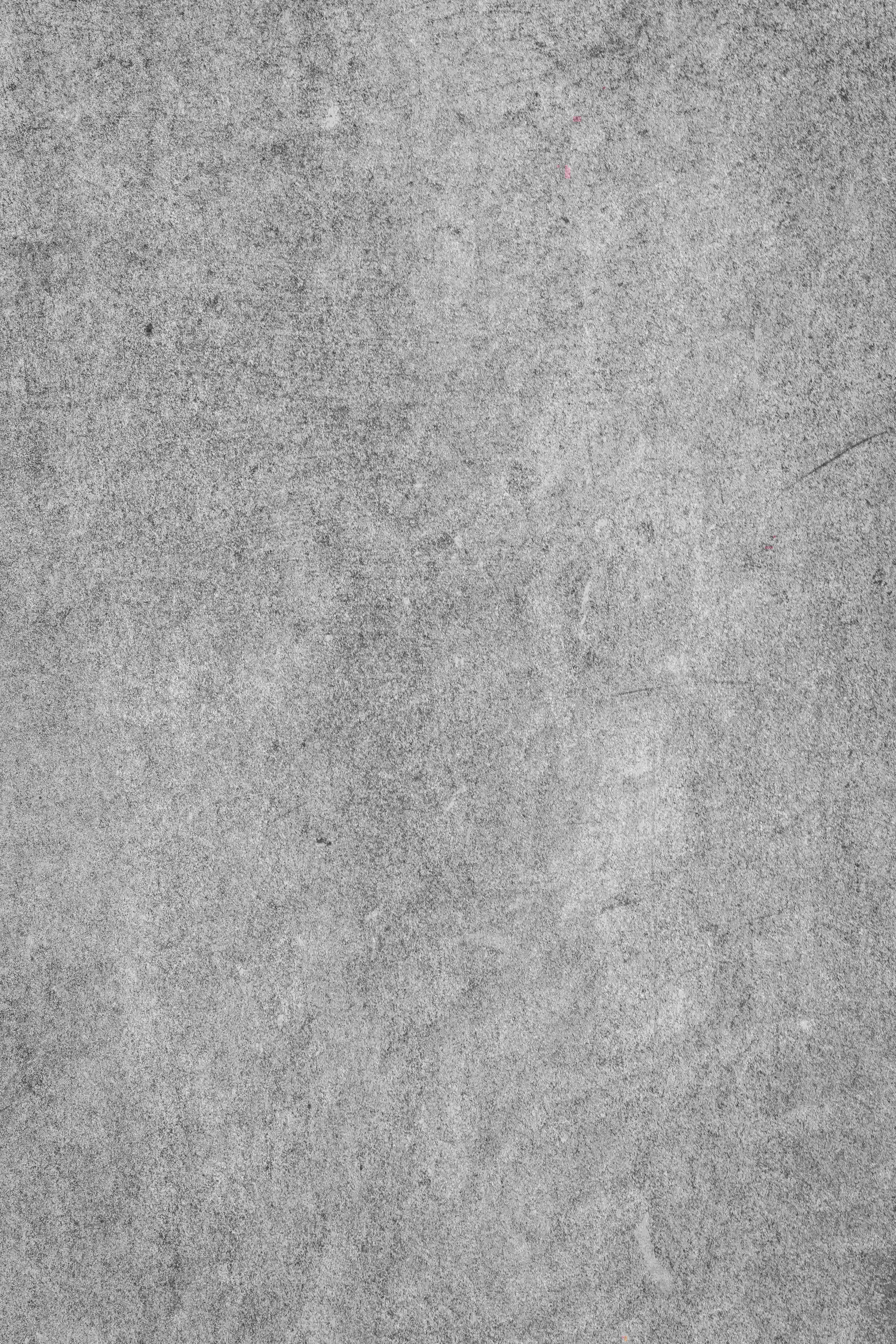 Gray Texture 桌布 壁紙 — 風化灰色混凝土表面的特寫，帶有細微紋理和輕微刮痕。