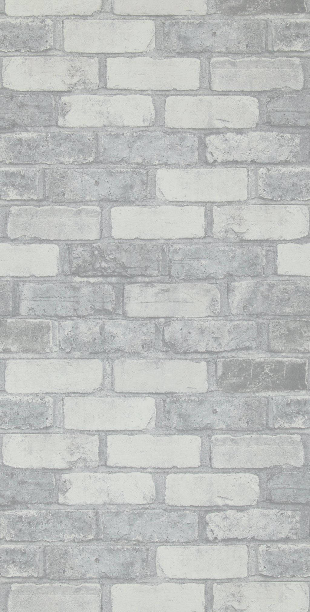 Brick Wall 桌布 壁紙 — 風化灰色磚牆的特寫，色調多變，砂漿線條營造出紋理豐富的城市背景。