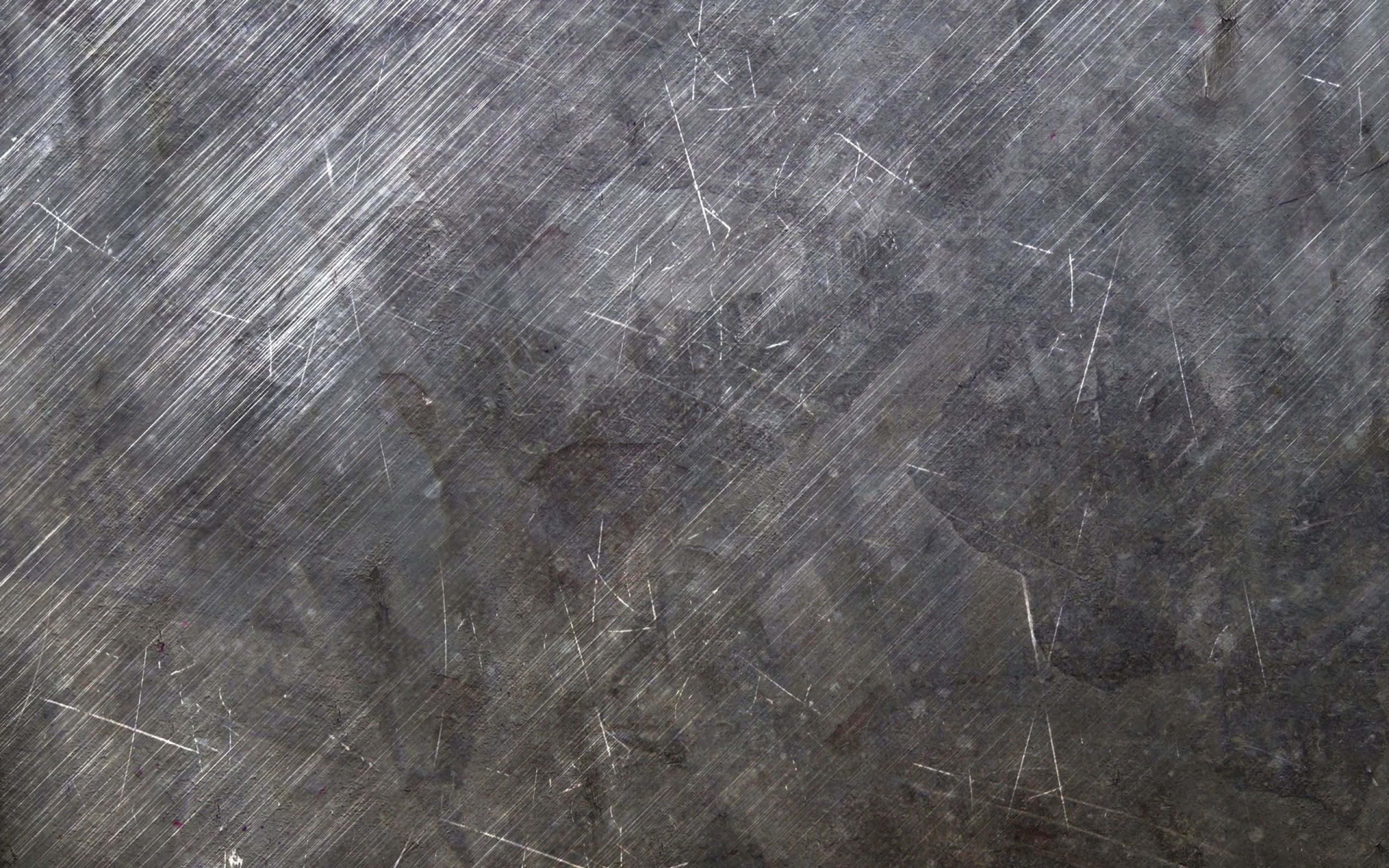 Steel 桌布 壁紙 — 風化灰色金屬表面的特寫，佈滿對角刮痕和磨損痕跡。
