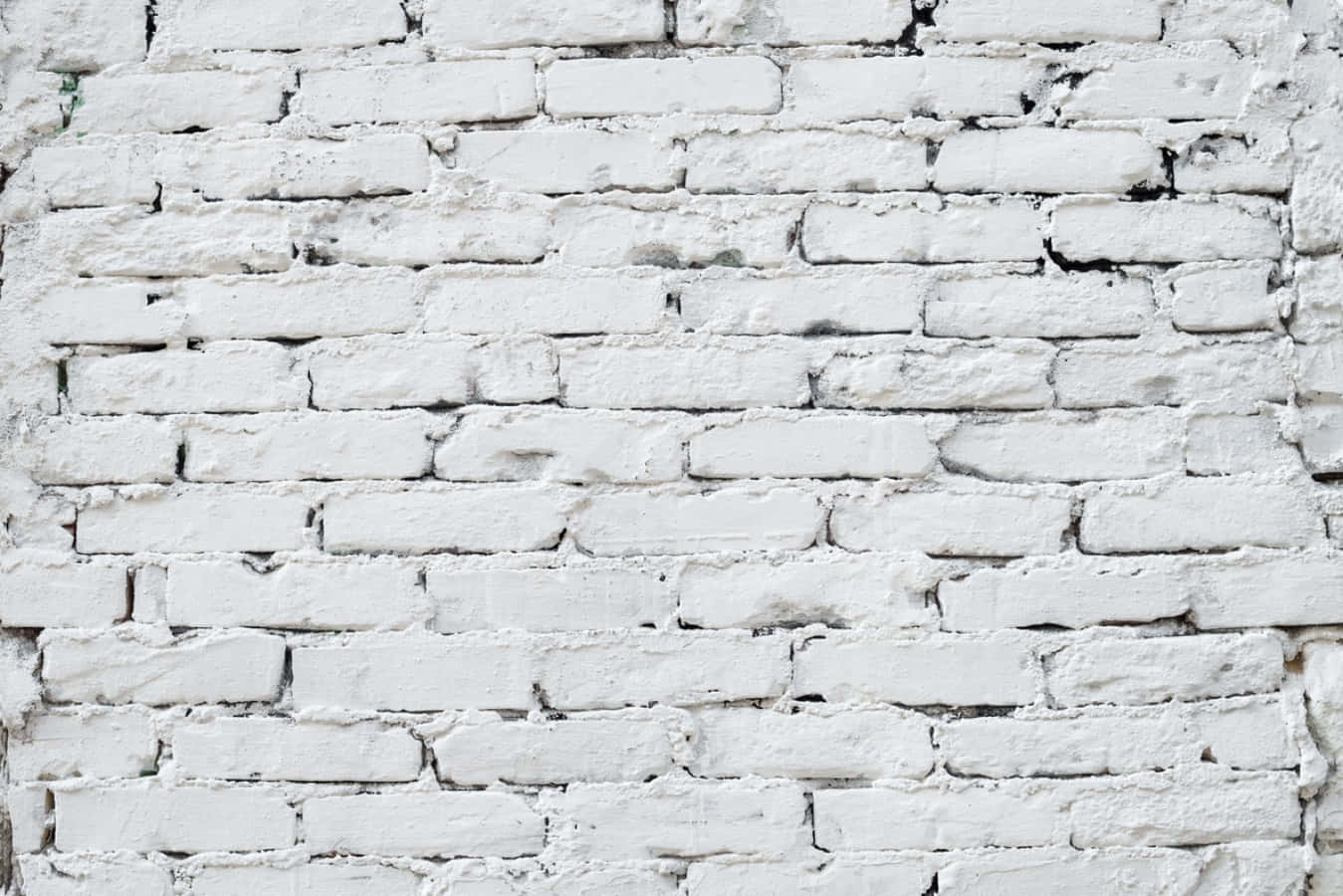 White Brick Wall 桌布 壁紙 — 風化白色磚牆的特寫，帶有可見紋理和深色砂漿線。