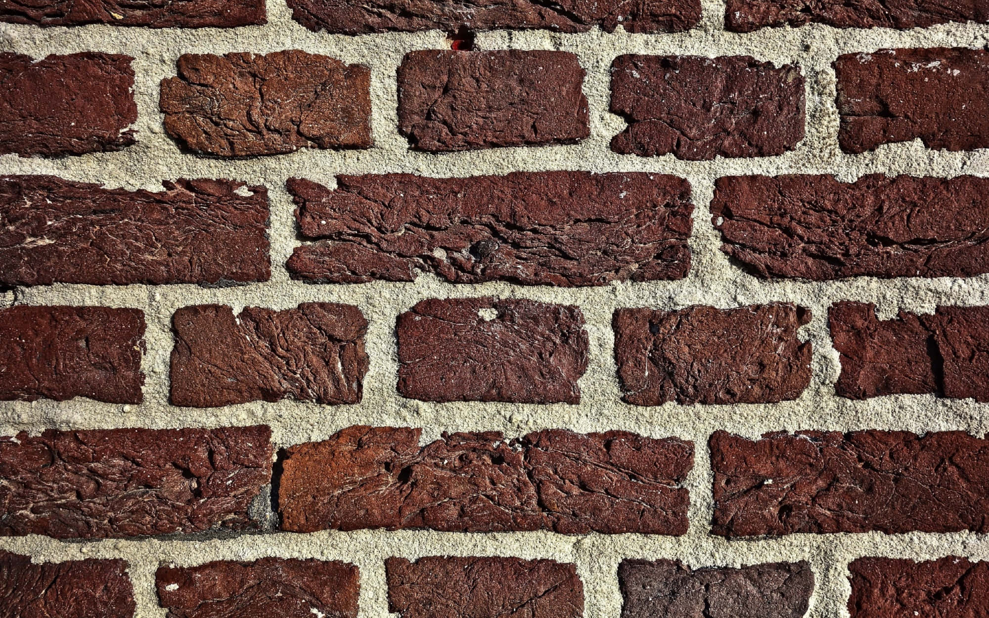 Brick 桌布 壁紙 — 風化紅磚牆的特寫，帶有紋理砂漿線條，展現鄉村城市衰敗。