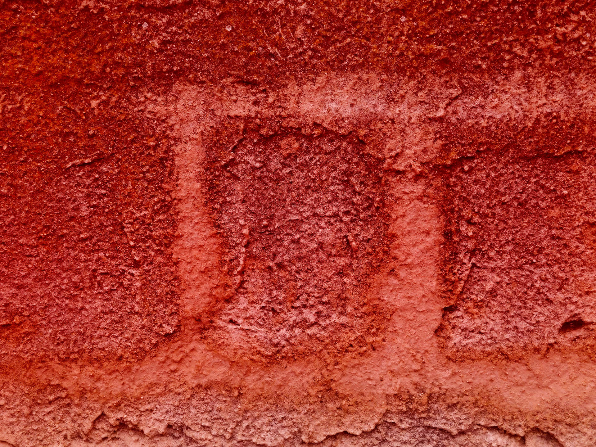 Red stone texture 壁紙 — 風化紅磚牆的特寫，顯示粗糙紋理和褪色的砂漿線。