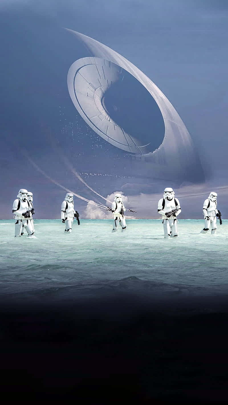 Scarif 桌布 壁紙 — 風暴兵在暮色天空中巨大的死星下，穿越荒涼的冰原行進。
