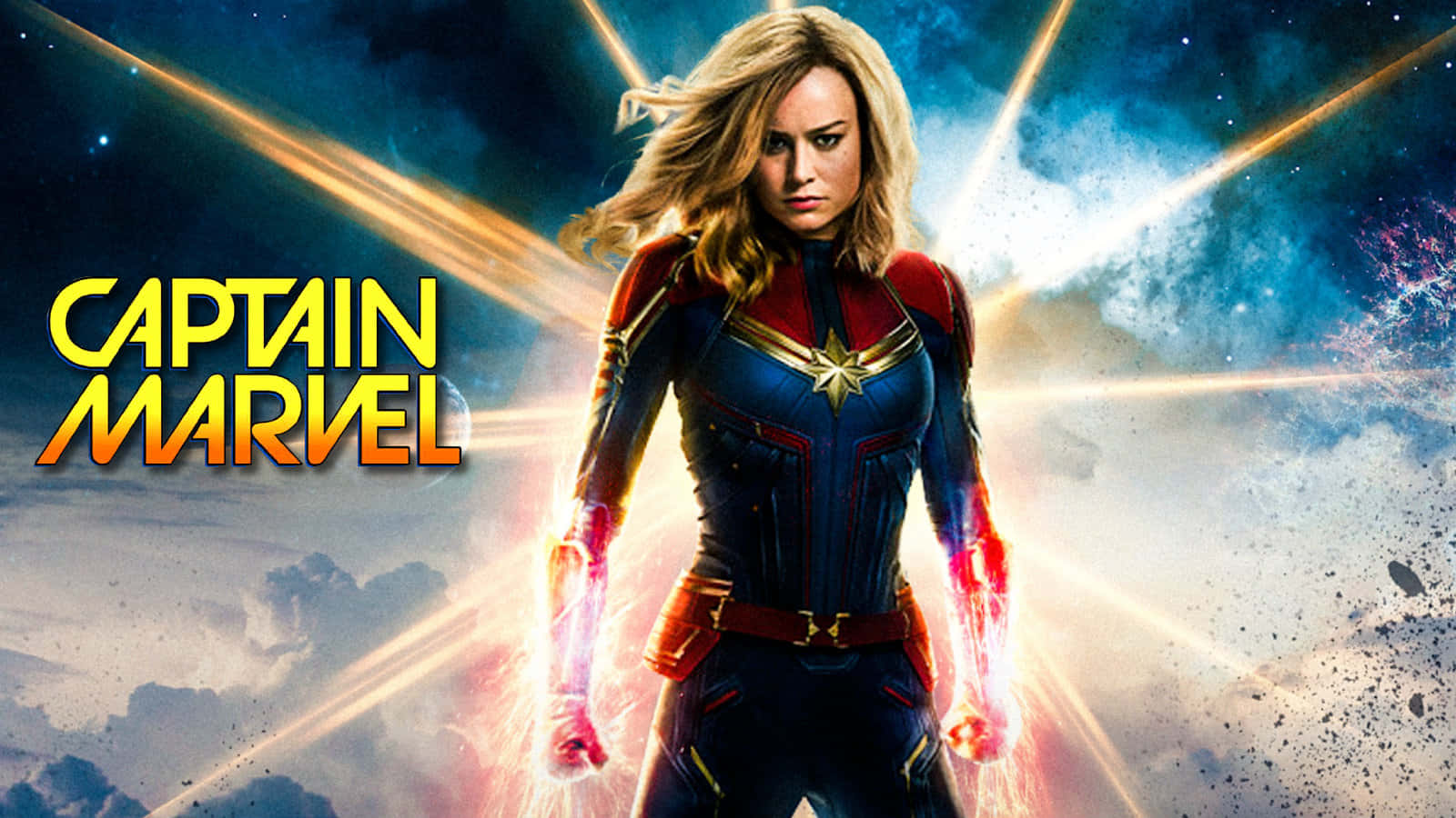 Best Captain Marvel 桌布 壁紙 — 驚奇隊長在宇宙背景下強勢站立，拳頭散發出耀眼的能量。