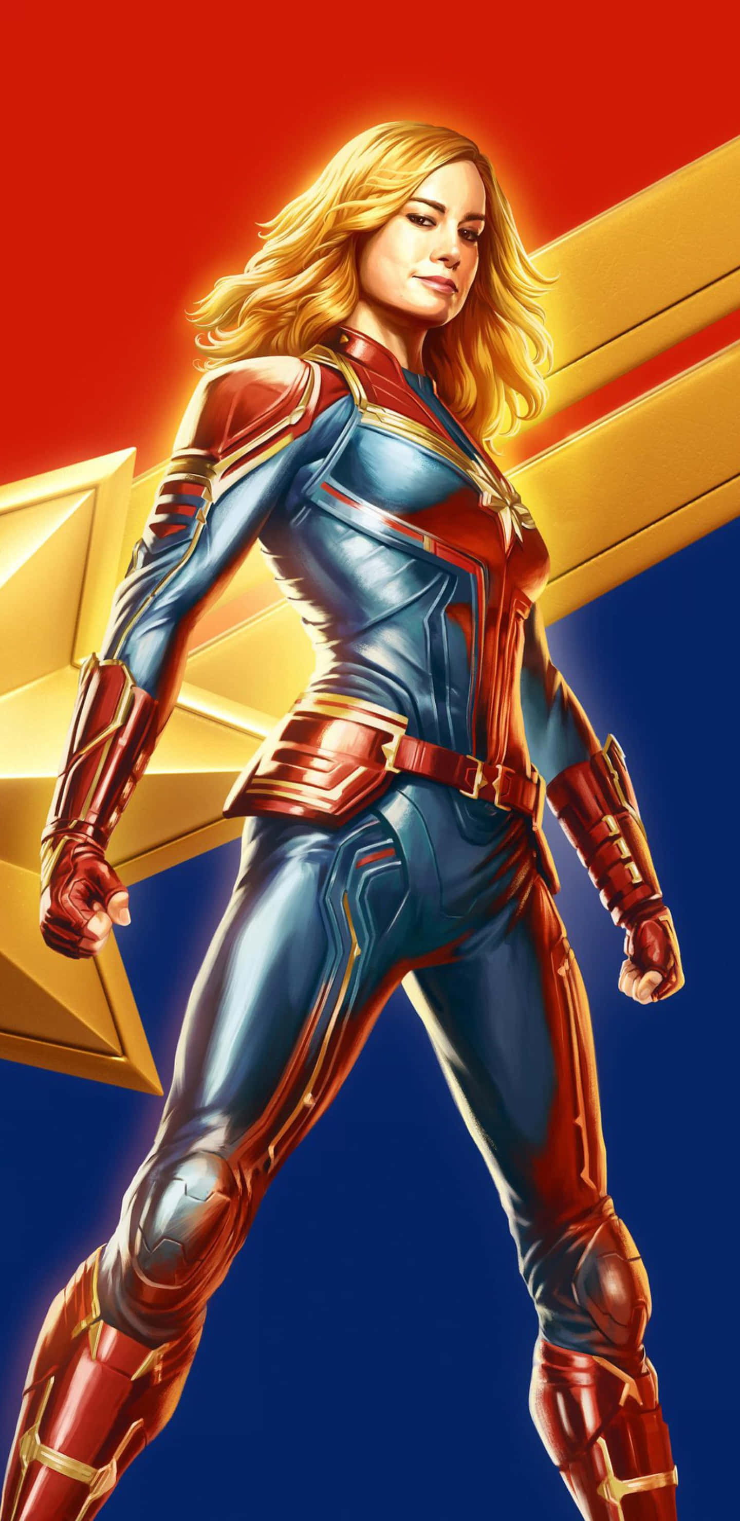 Pixel 3xl Captain Marvel 桌布 壁紙 — 驚奇隊長自信地穿著她的藍色和紅色套裝，站在大膽的紅色和金色星星背景前。