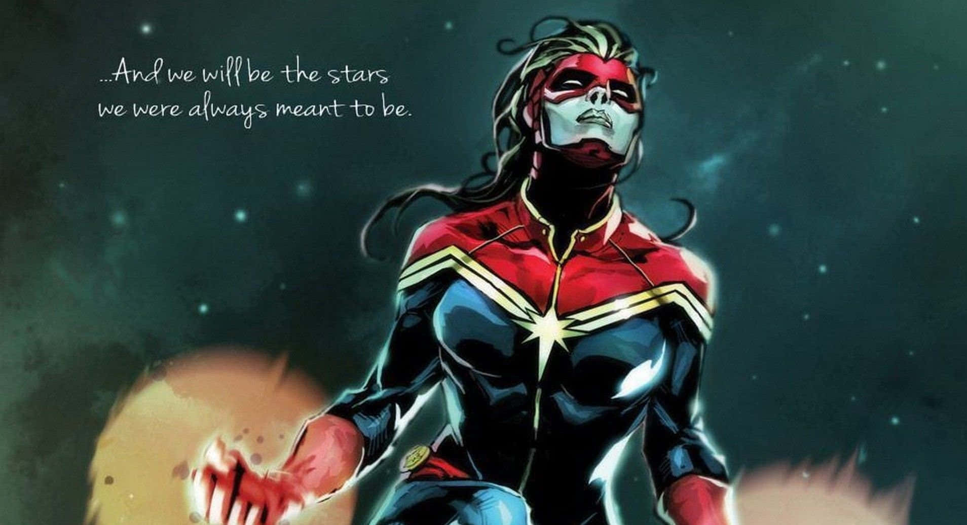 Captain Marvel 桌布 壁紙 — 驚奇隊長英雄式地站在星光燦爛的宇宙背景前，雙手發光，表情堅定。