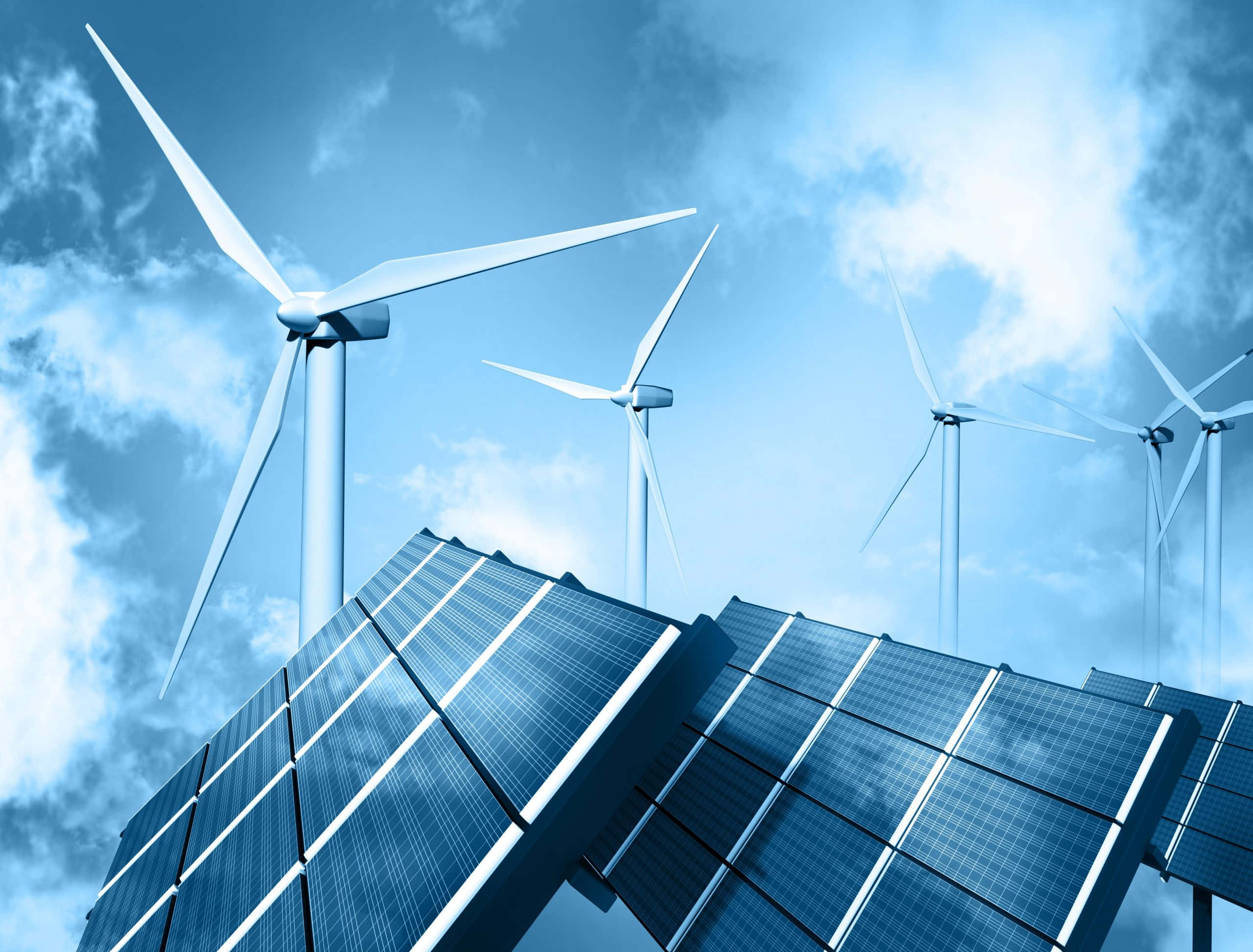 Energy 桌布 壁紙 — 高聳的風力渦輪機和傾斜的太陽能板主導著一片有零星雲朵的明亮藍天。