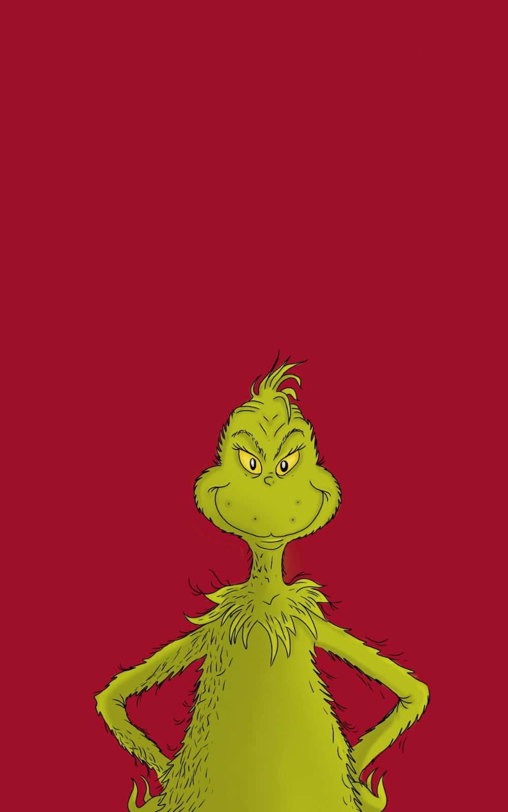 Cute Grinch 桌布 壁紙 — 鬼靈精雙手叉腰站在純紅色背景前，他的綠色毛髮和暴躁表情被生動地描繪出來。