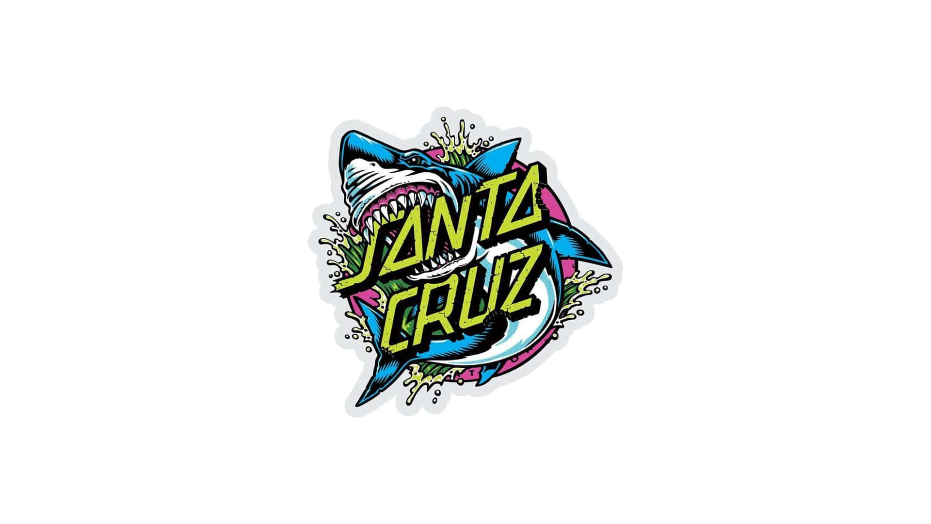 Santa Cruz 桌布 壁紙 — 鮮明的卡通鯊魚標誌，帶有粗體黃色文字和潑濺效果，背景為白色。