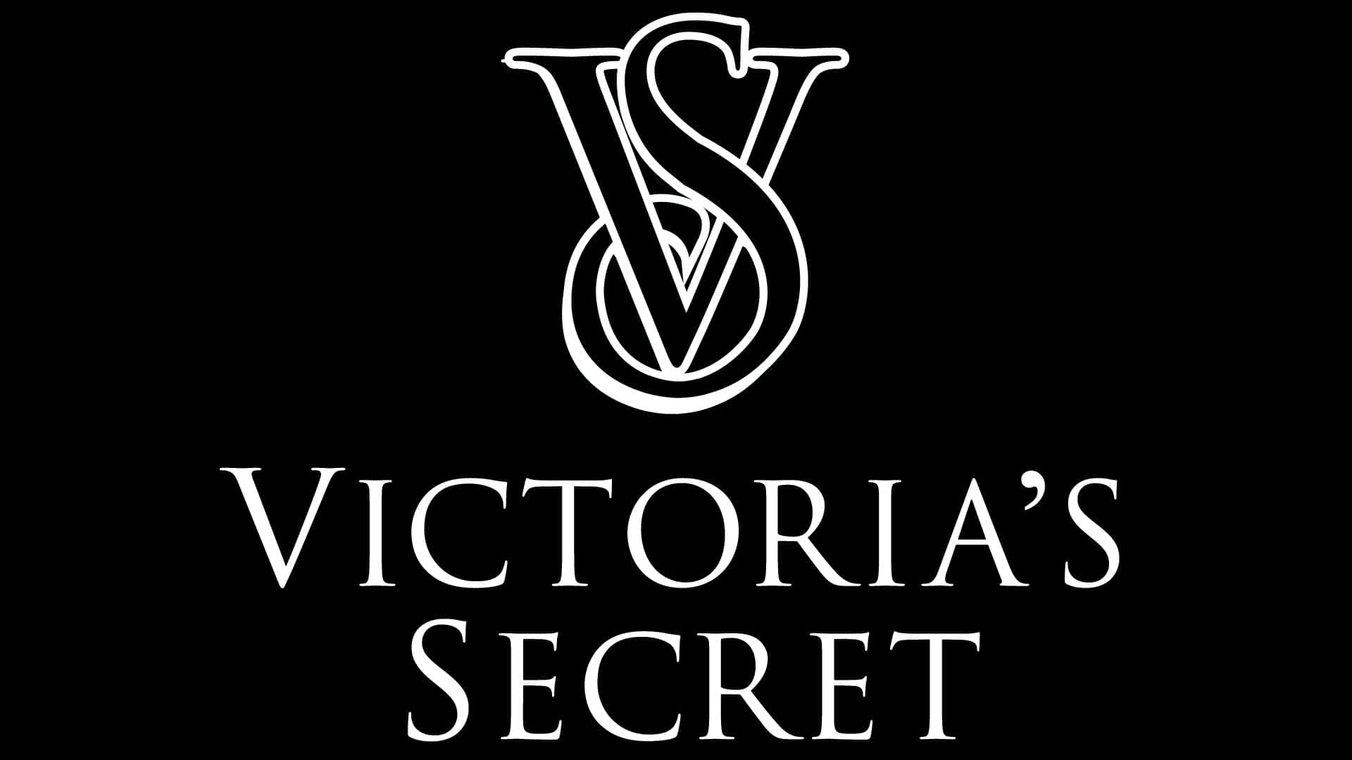 Victoria Secret 桌布 壁紙 — 鮮明的黑色背景上，展示了標誌性的白色Victoria's Secret標誌，交織的V和S字母組合位於優雅襯線字體的品牌名稱上方。