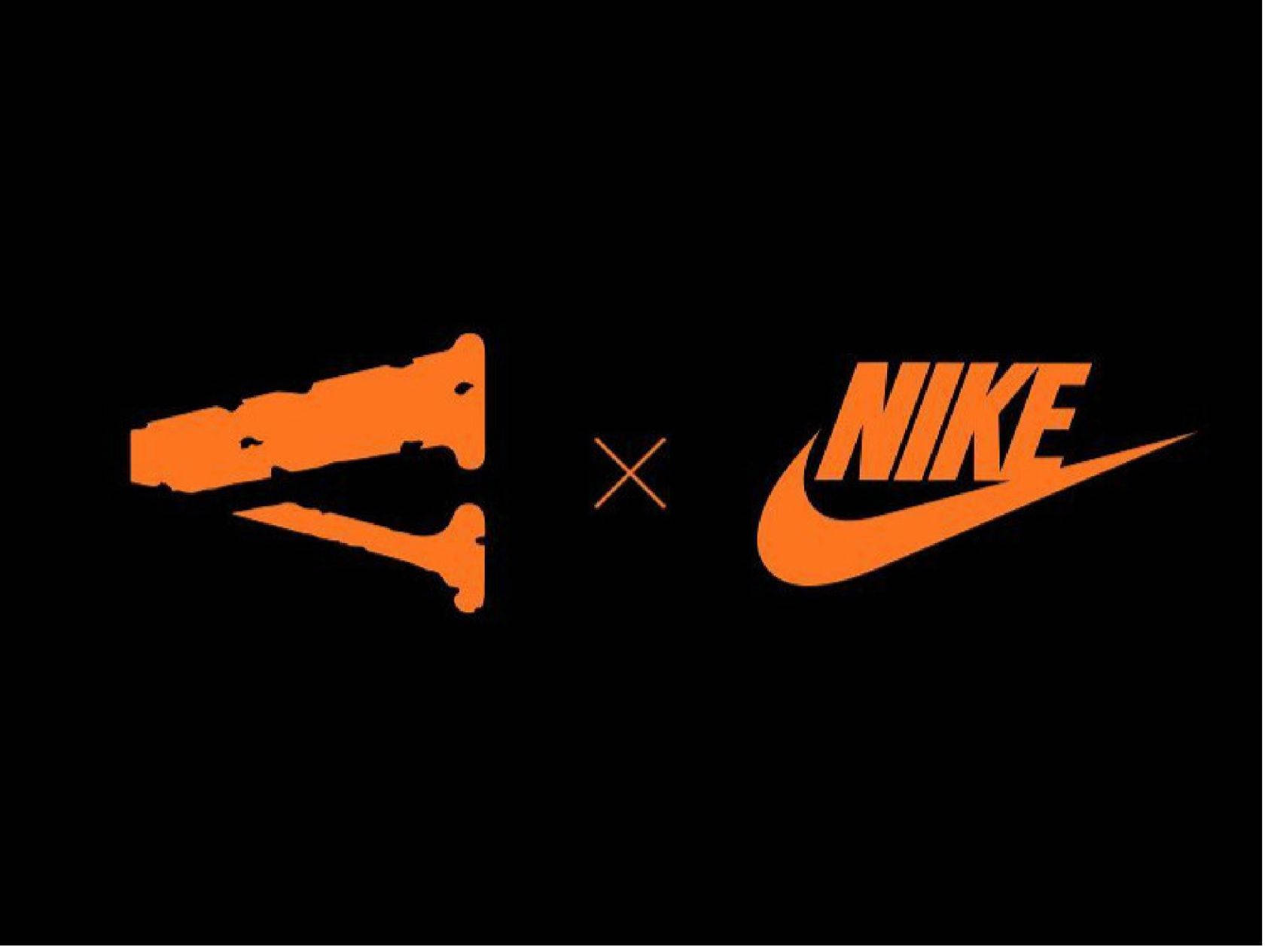 Vlone 桌布 壁紙 — 鮮橙色 Staple x Nike 聯乘標誌，襯托在純黑背景上。