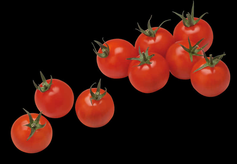Tomato Plant 桌布 壁紙 — 鮮紅小番茄搭配綠色莖部，以對角線排列在純黑背景上。
