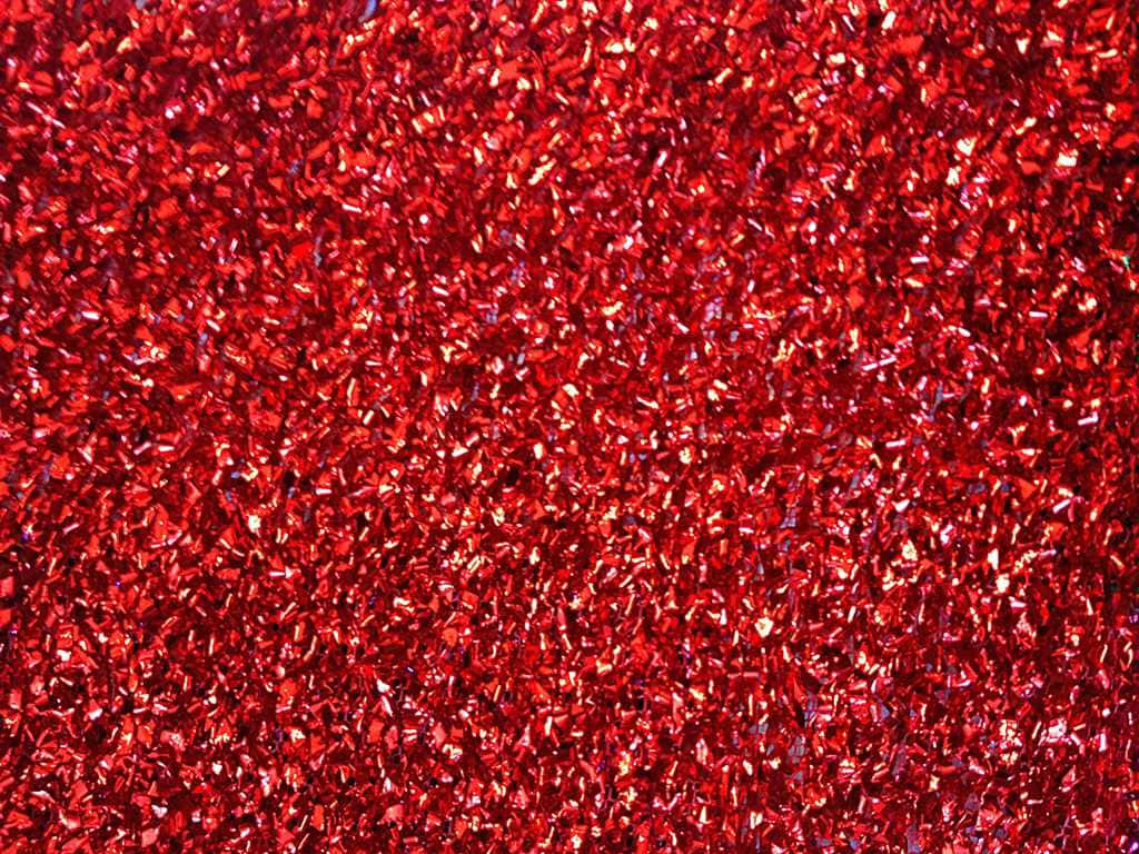 Red Glitter 桌布 壁紙 — 鮮紅色亮粉的特寫，閃爍的切面捕捉整個畫面的光線。