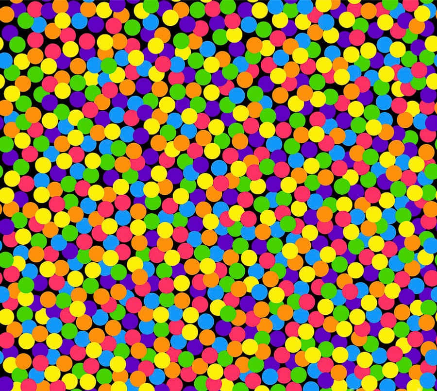 Confetti 桌布 壁紙 — 鮮豔多彩的圓點密集地散佈在黑色背景上，營造出俏皮的抽象圖案。