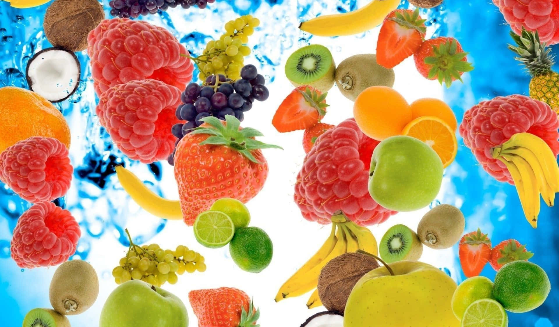 Fruits 桌布 壁紙 — 鮮豔多樣的新鮮水果懸浮在動態的藍色水花中，背景為明亮的白色。
