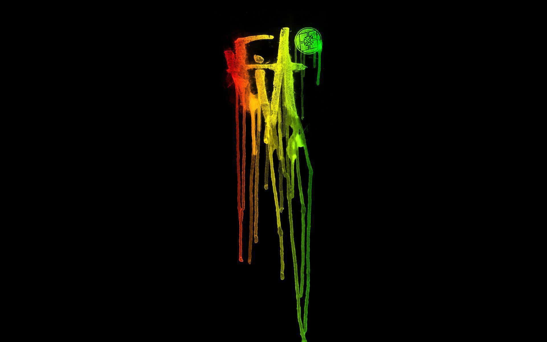 Rasta 桌布 壁紙 — 鮮豔滴落的彩虹顏料在純黑背景上形成字母「FIT」。