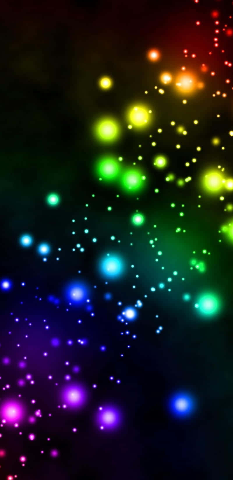 Rainbow Glitter 桌布 壁紙 — 鮮豔發光的球體以彩虹色調層疊，在黑暗的宇宙背景下形成動態的數位粒子效果。
