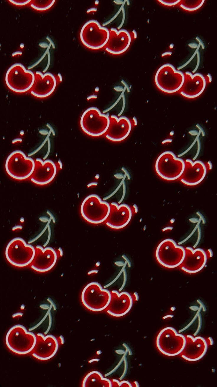 retro aesthetic iPhone 桌布 壁紙 — 鮮豔發光的紅櫻桃配綠色莖桿，在深色斑點背景上以重複圖案漂浮。