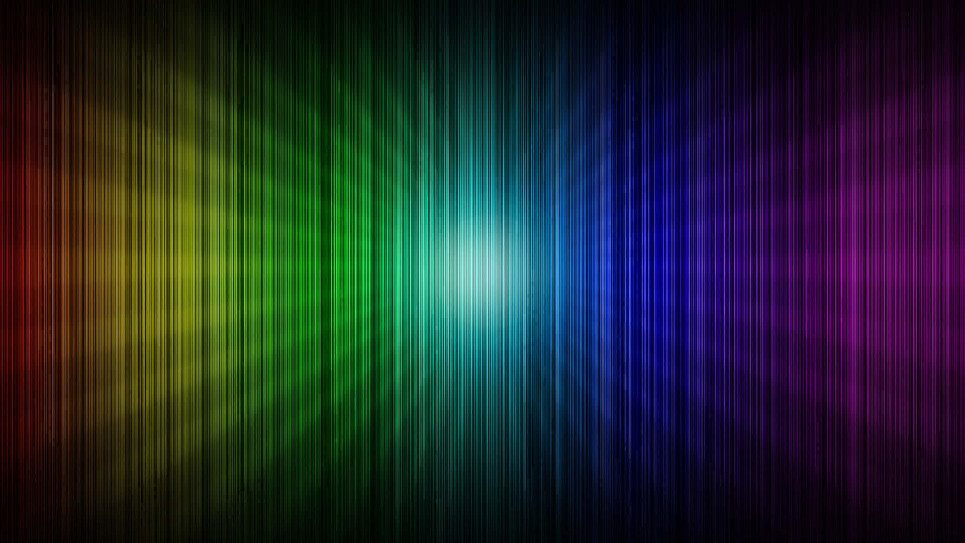 Rainbow Colours 桌布 壁紙 — 鮮豔的垂直彩虹光線從明亮的中心向黑暗背景輻射。