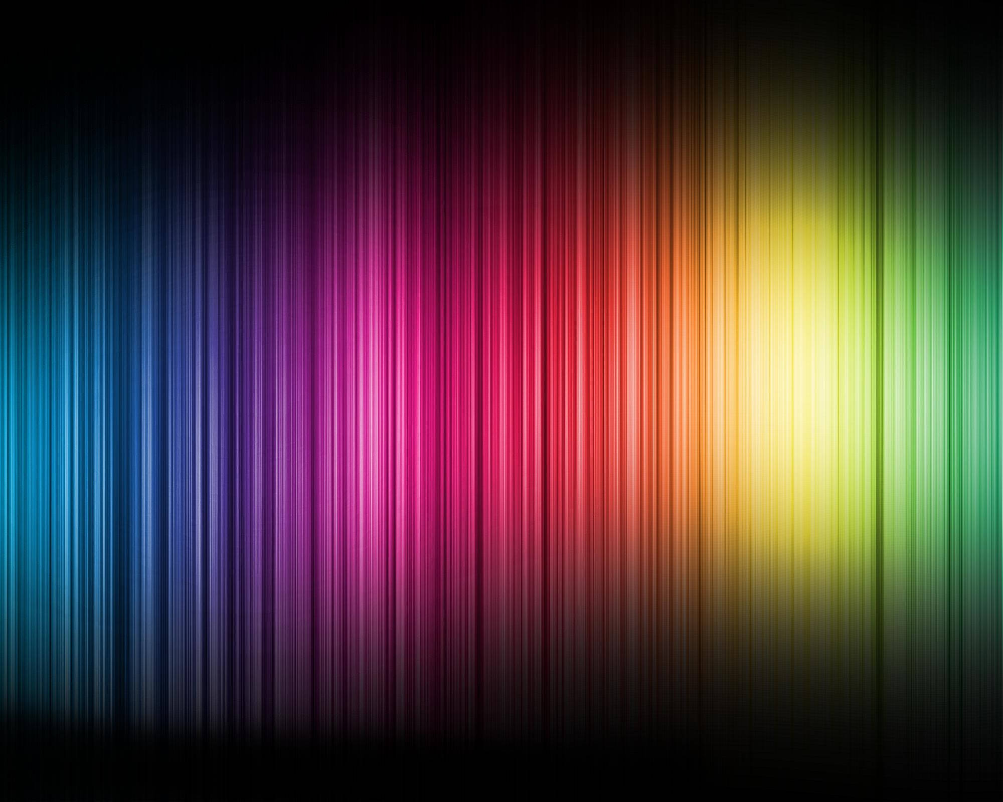 Spectrum 桌布 壁紙 — 鮮豔的垂直彩虹條紋在深色背景上發光，營造出充滿活力的數位漸變效果。