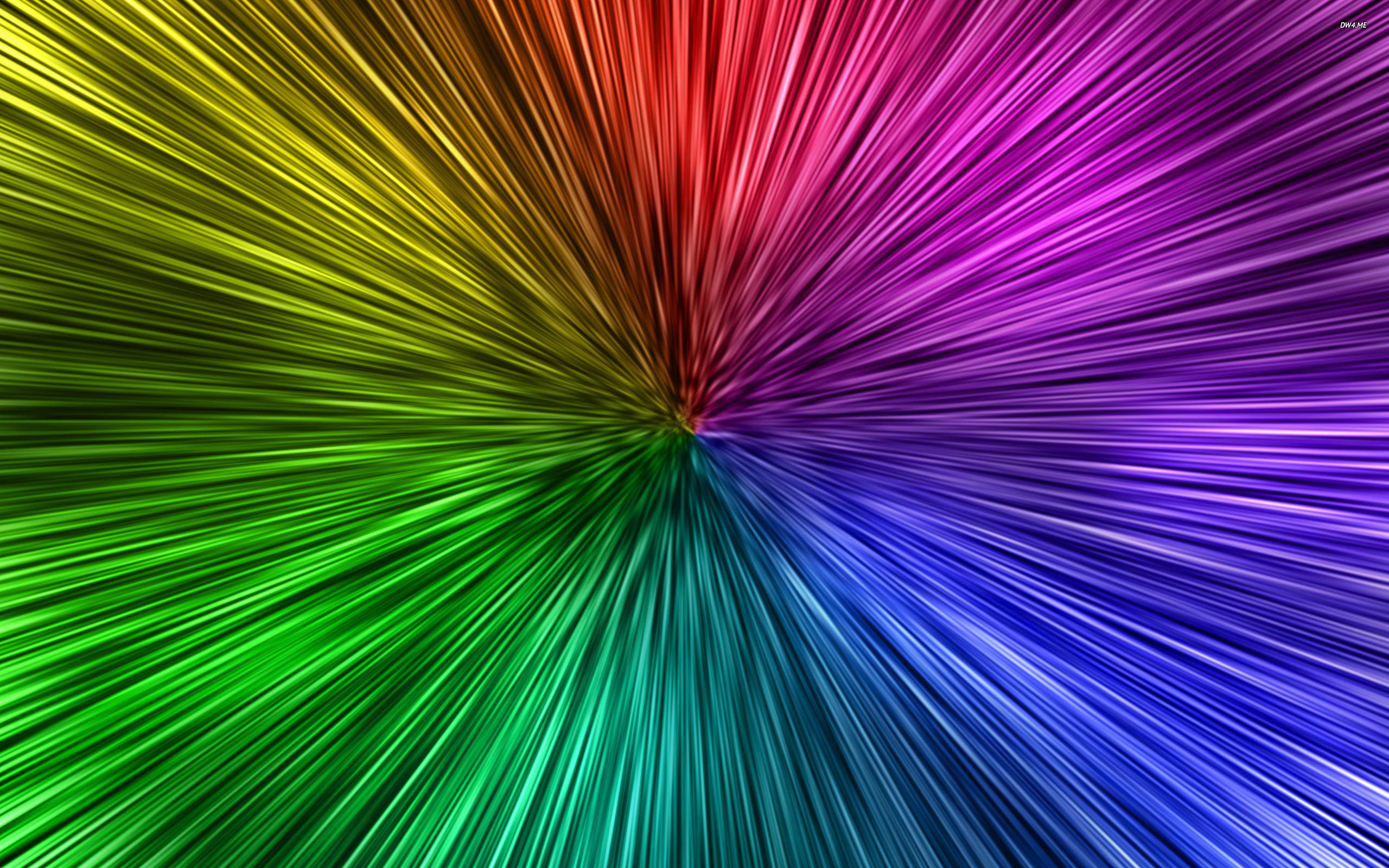 Cool Neon 桌布 壁紙 — 鮮豔的彩虹光線從中心點向外爆發，形成動態的放射狀圖案。