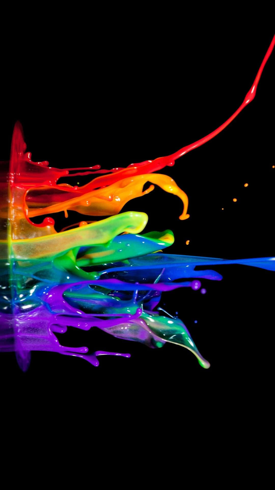 Paint Splatter 桌布 壁紙 — 鮮豔的彩虹顏料飛濺在純黑背景上動態爆炸，形成高對比度的色彩爆發。