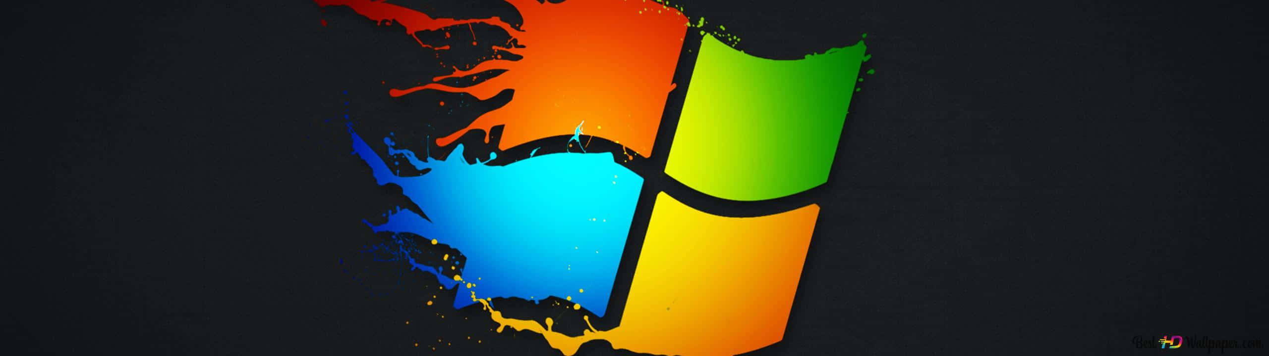Windows Xp Logo 桌布 壁紙 — 鮮豔的油漆飛濺在深色背景上形成標誌性的Windows標誌。