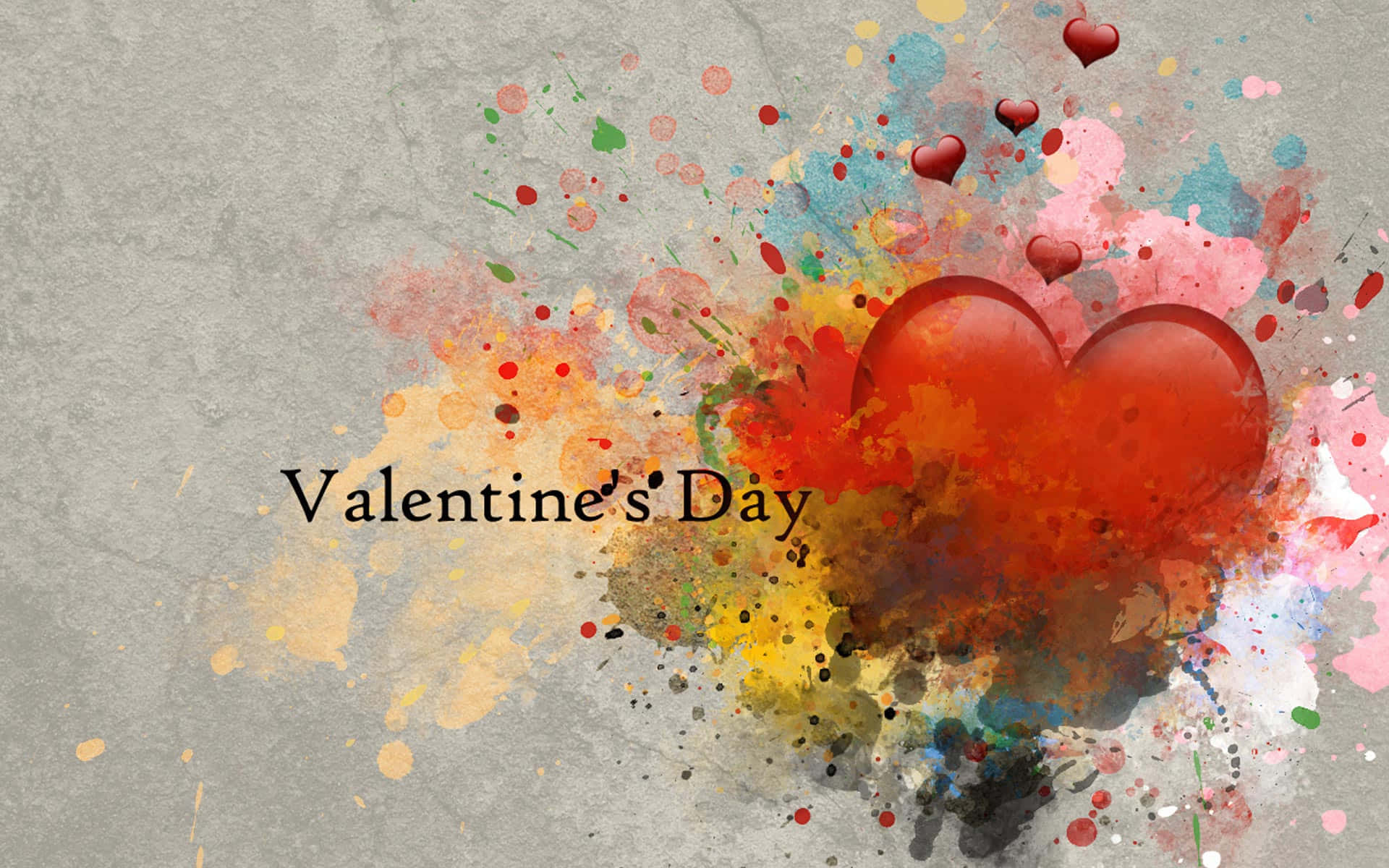 Valentines 桌布 壁紙 — 鮮豔的油漆飛濺從兩個光滑的紅色心形中迸發出來，背景是帶有紋理的灰色，並有「Valentine's Day」文字。
