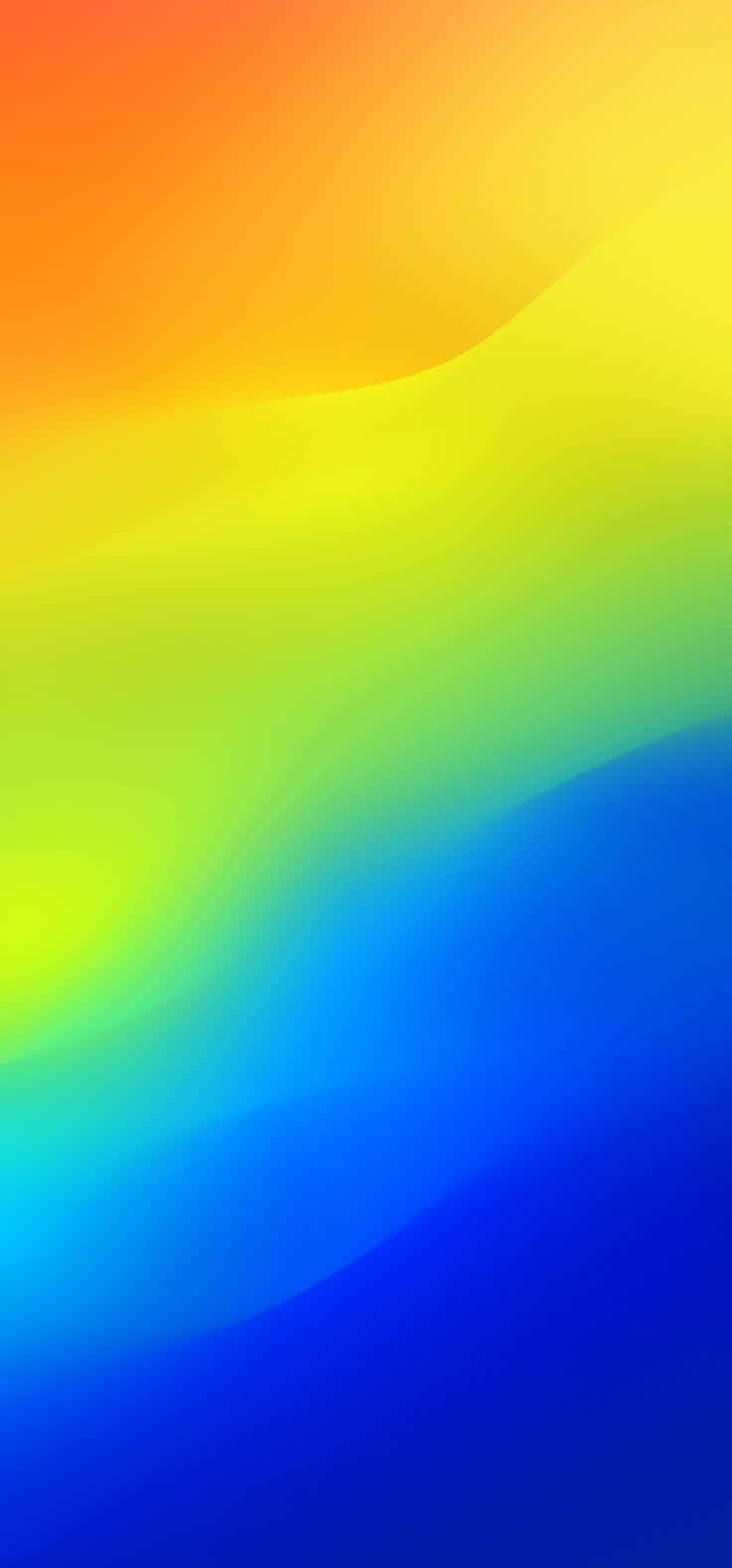 Green And Yellow 桌布 壁紙 — 鮮豔的漸層從溫暖的橙色流動到清涼的藍色，柔和波浪般的過渡營造出舒緩的抽象背景。