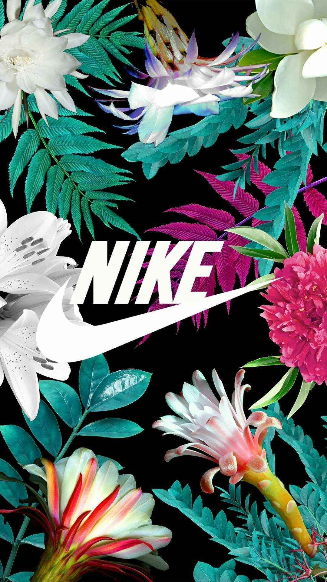 nike girl 桌布 壁紙 — 鮮豔的熱帶花朵和葉子以電光色彩環繞著一個大膽的白色Nike標誌，背景為黑色。