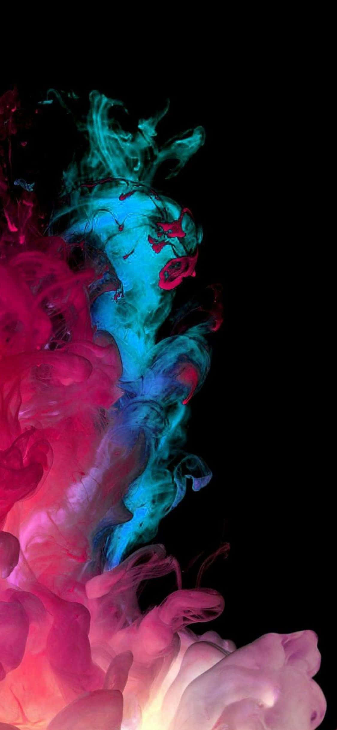 iPhone X AMOLED 桌布 壁紙 — 鮮豔的粉紅色和青色墨水漩渦在漆黑的背景上爆炸，形成動態的抽象構圖。