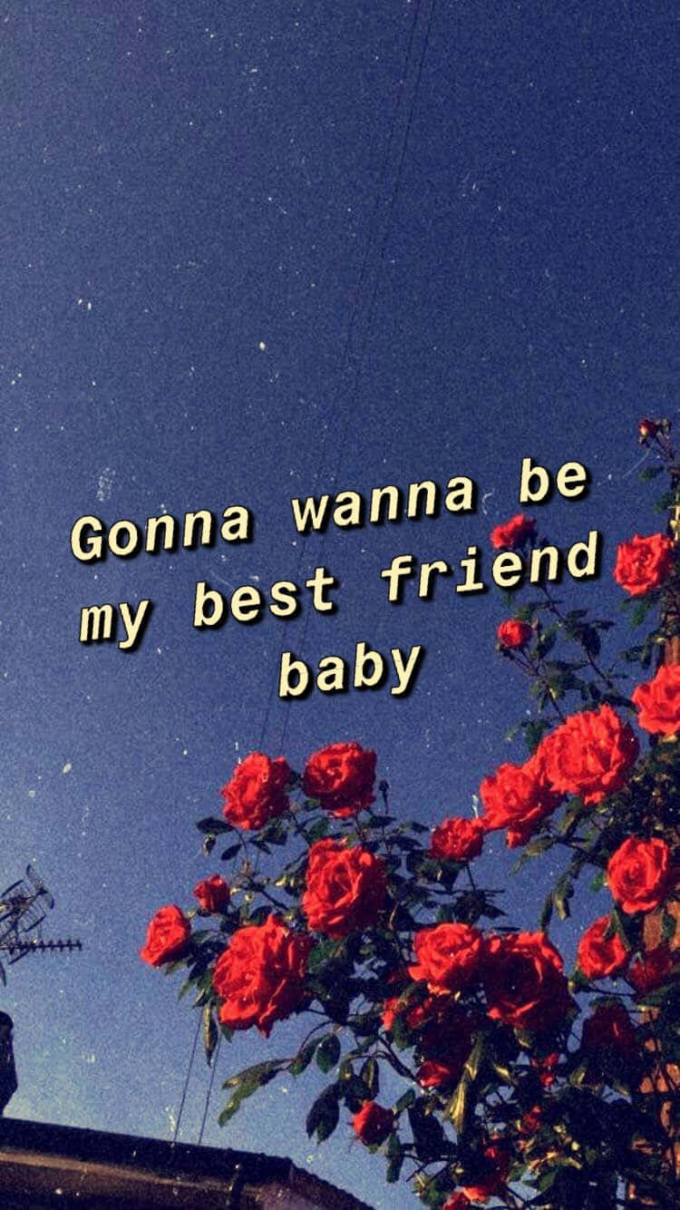摯友 桌布 壁紙 — 鮮豔的紅玫瑰在星空下綻放，文字疊加顯示「Gonna wanna be my best friend baby」。