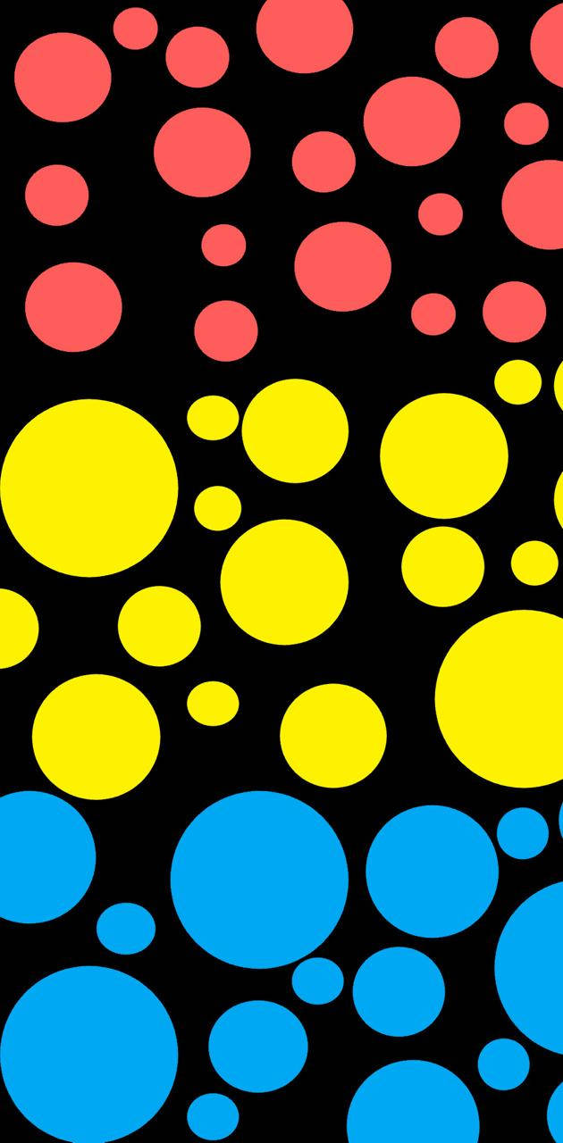 Pansexual 桌布 壁紙 — 鮮豔的紅色、黃色和藍色圓圈在純黑色背景上以俏皮的幾何圖案漂浮。