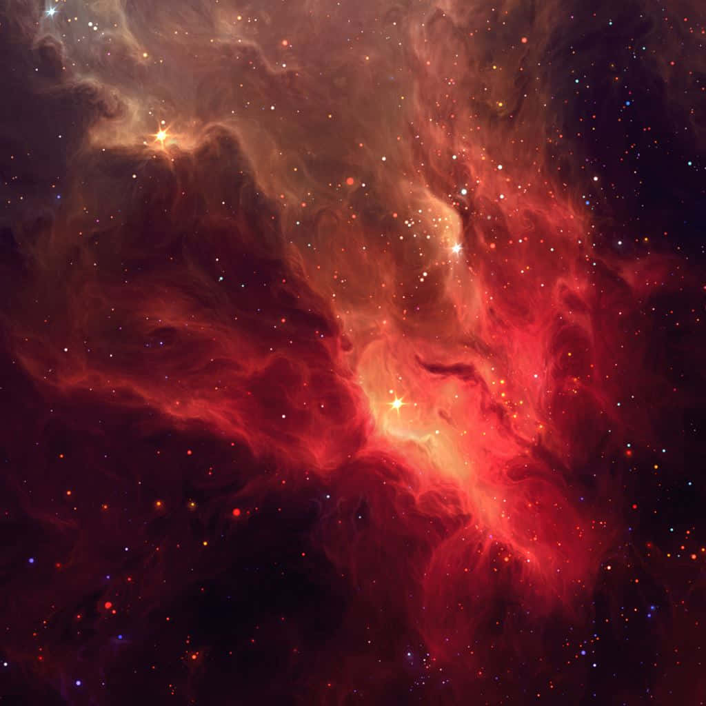 星雲 桌布 壁紙 — 鮮豔的紅色和橙色宇宙雲層在深邃的黑色太空背景下與發光的星星一起旋轉。