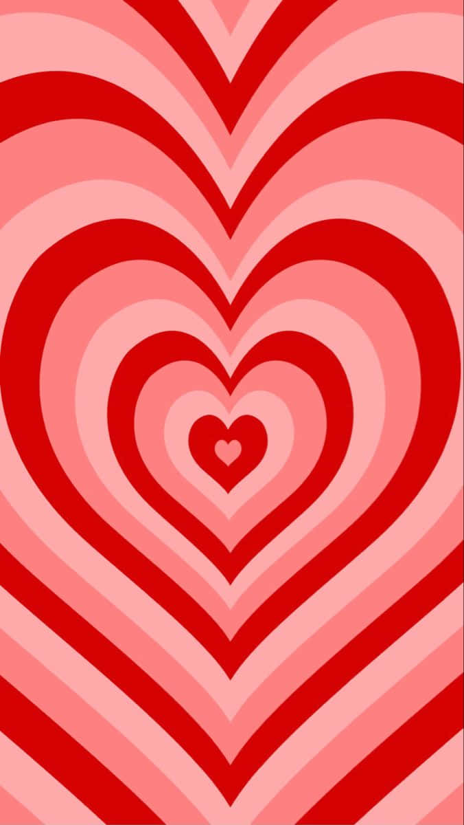 Y2k Heart 桌布 壁紙 — 鮮豔的紅色和粉紅色同心心形在催眠復古圖案中向外輻射。