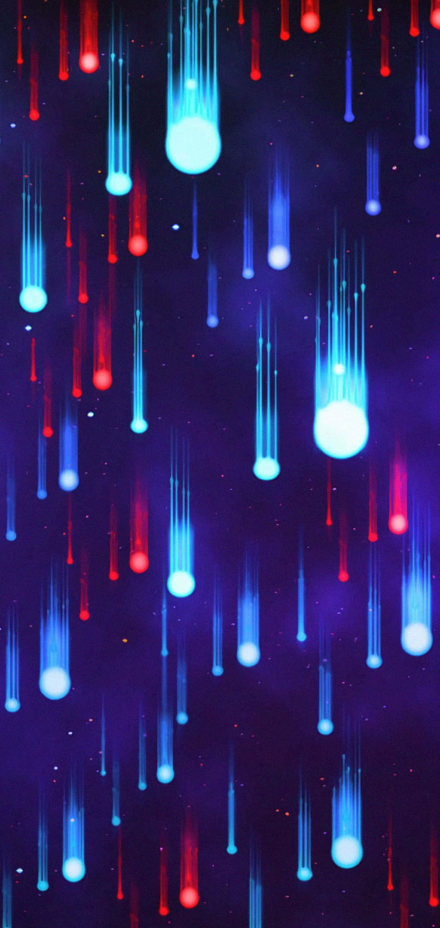 Galaxy S10 Plus 桌布 壁紙 — 鮮豔的紅色和藍色流星斜穿過深紫色的星空夜空。