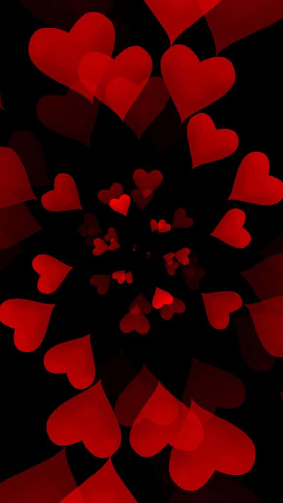Red Heart 桌布 壁紙 — 鮮豔的紅色心形在深黑色背景上以催眠般的螺旋向外輻射。