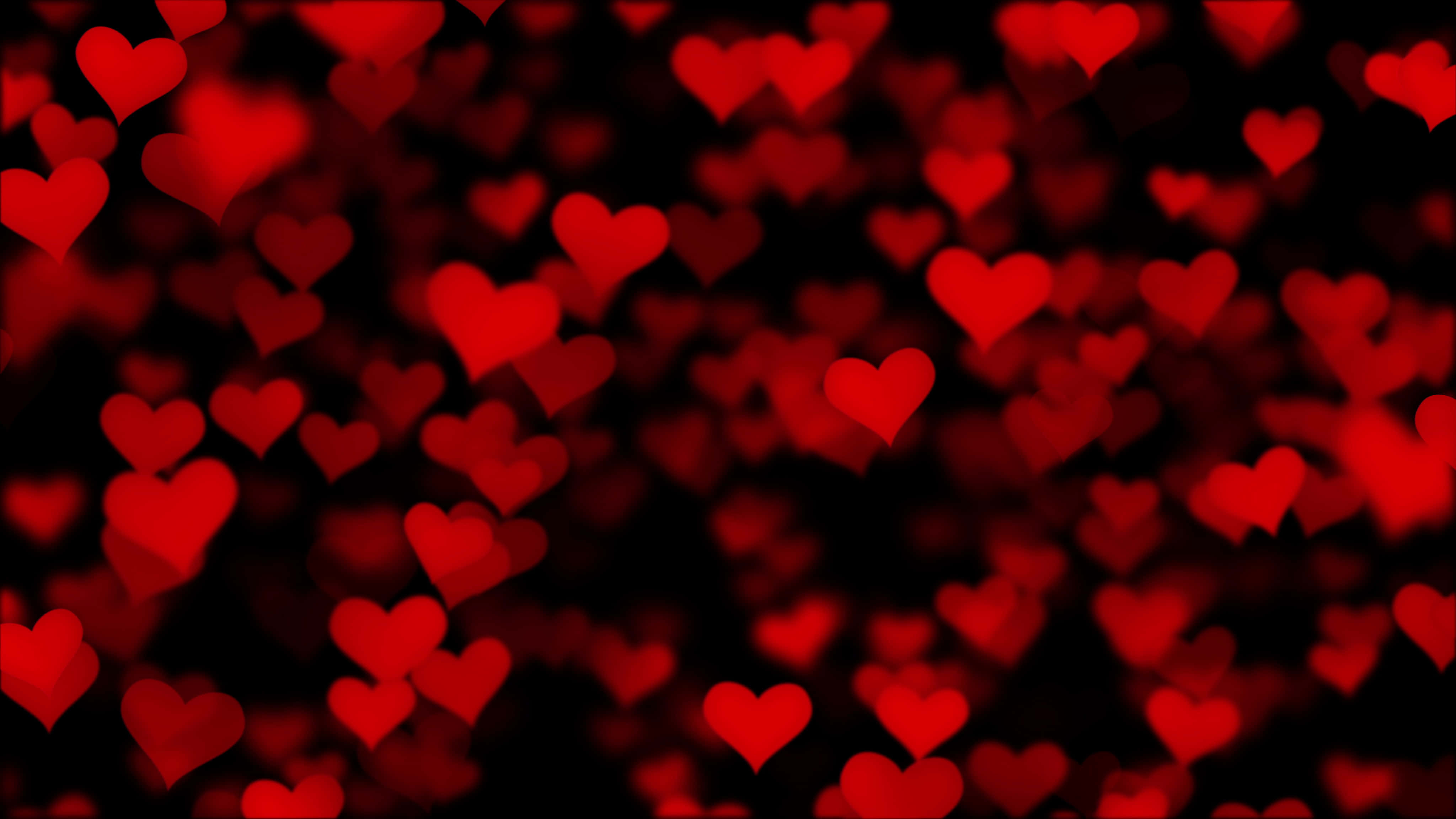 Heart Pattern 桌布 壁紙 — 鮮豔的紅色心形在深黑色背景上柔和漂浮，營造出浪漫夢幻的散景效果。