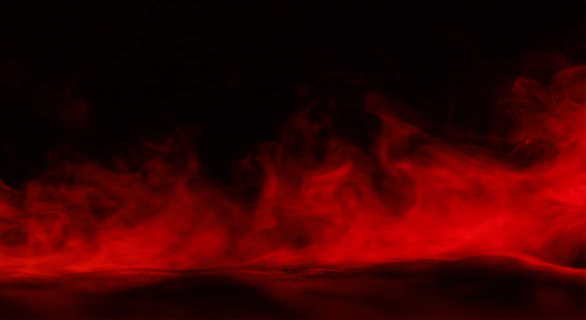 Red Smoke Effect 桌布 壁紙 — 鮮豔的紅色煙霧在漆黑的背景上翻騰，營造出強烈而神秘的氛圍。