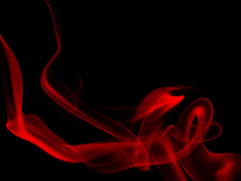 Red Smoke Effect 桌布 壁紙 — 鮮豔的紅色煙霧在純黑背景上優雅地旋轉，營造出抽象而戲劇性的視覺效果。