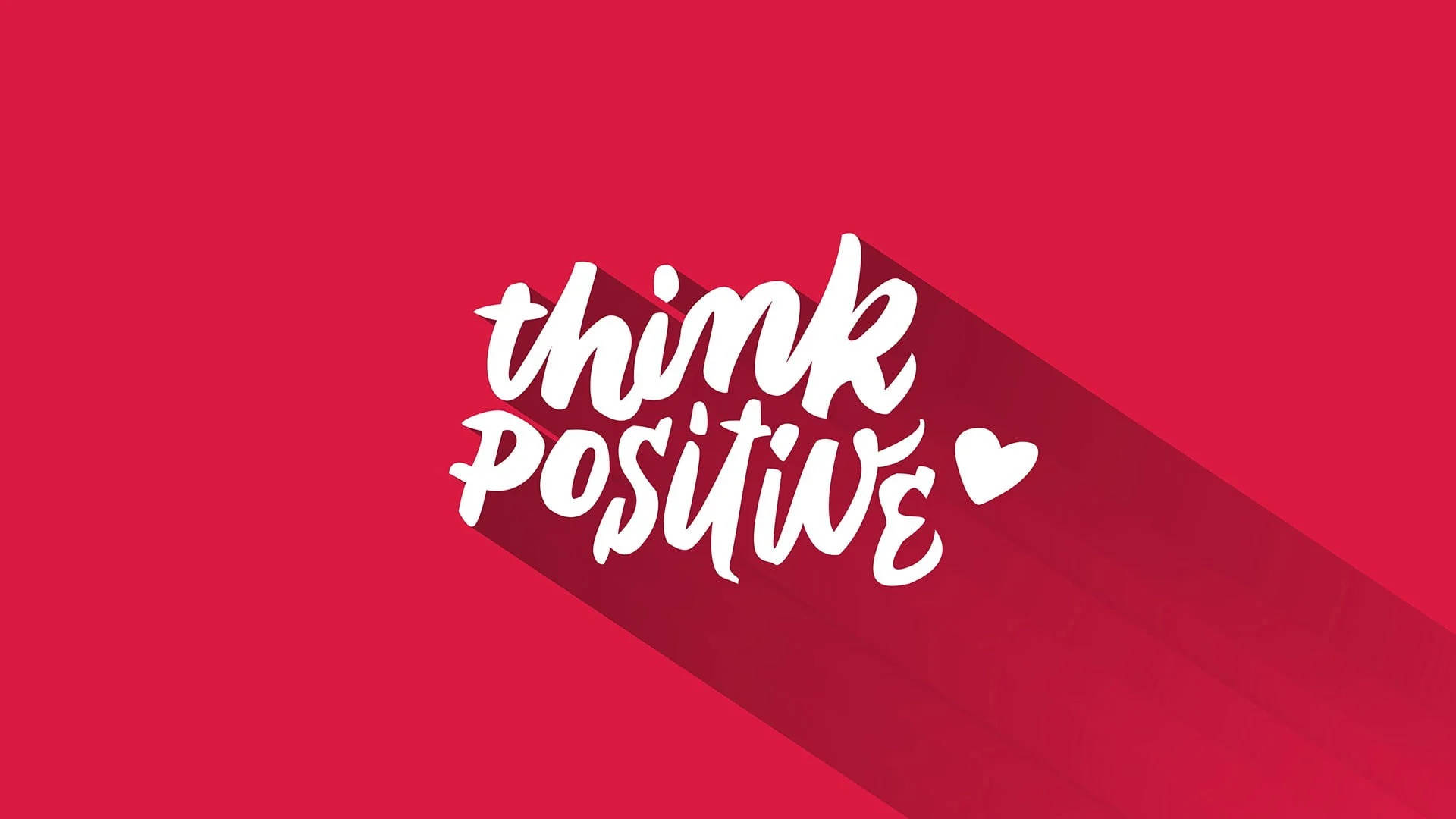 Typography 桌布 壁紙 — 鮮豔的紅色背景上帶有白色風格文字「think positive」，並有心形圖示和長陰影效果。